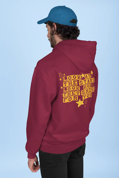 Back view of a male model wearing a maroon hoodie with the "Yellow" album artwork by Coldplay.