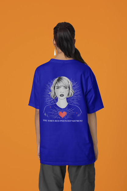 Back view of woman wearing blue Oversize Taylor Swift T-Shirt featuring Fortnight Theme.