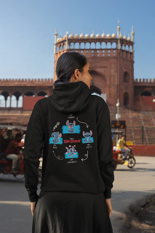 Back view of a female model wearing a black hoodie with a collage of Stitch images. The illustration shows Stitch in different poses, making various funny faces and expressions.