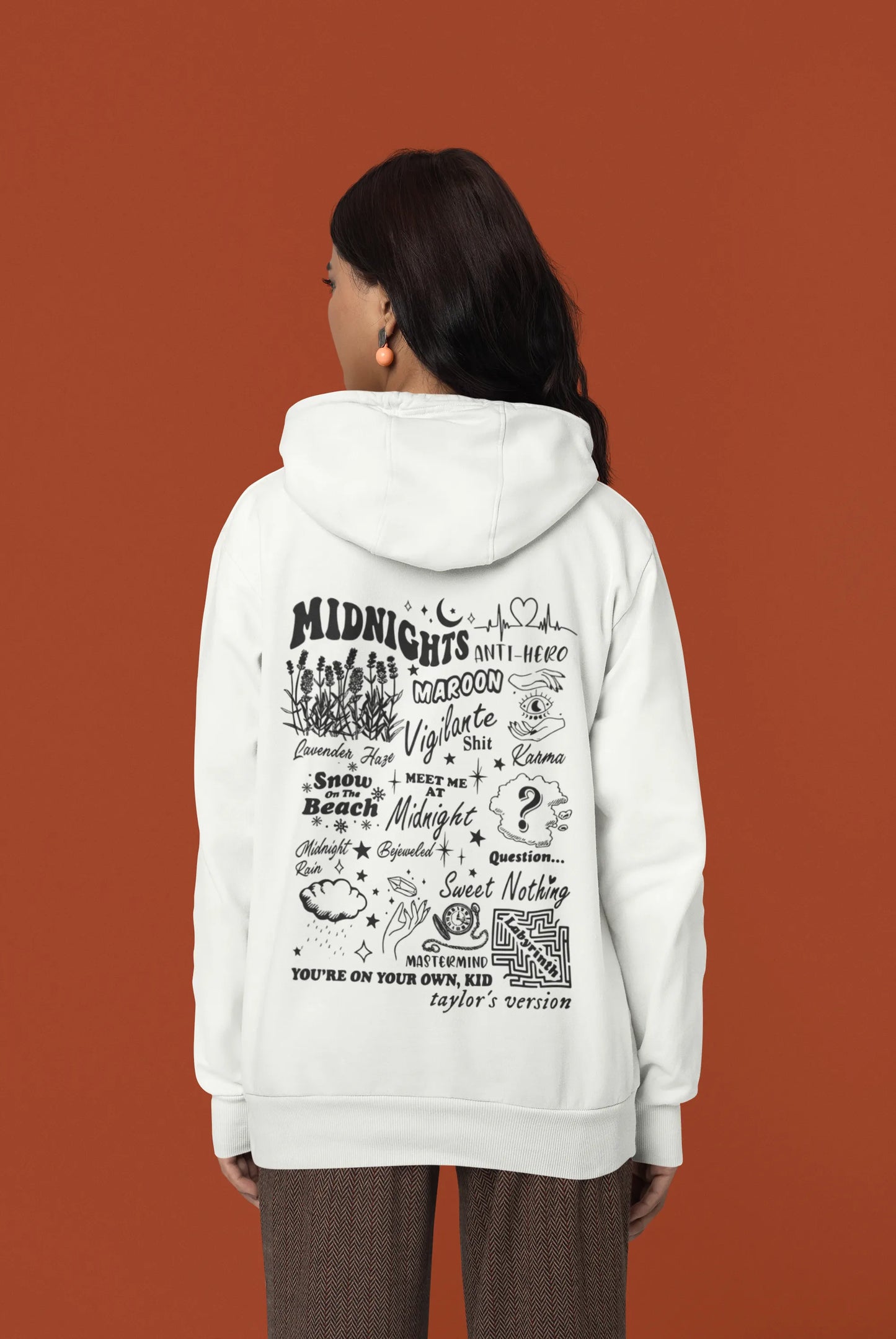Back view of a female model wearing an off-white Midnights-inspired hoodie. Perfect for Swifties and Eras Tour fans.
