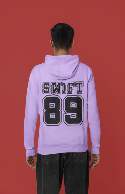 Back view of a male Model wearing a lavender Swift 89 hoodie, inspired by Taylor Swift's 1989 album. Perfect for Swifties and Eras Tour fans.