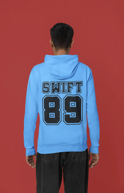 Back view of a male Model wearing a sky blue Swift 89 hoodie, inspired by Taylor Swift's 1989 album. Perfect for Swifties and Eras Tour fans.