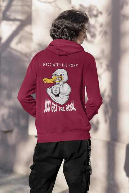 Back view of a male model wearing a maroon hoodie with a Disney design featuring a muscular duck and the text "The Honk."