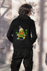 Back view of a male model wearing a black hoodie with a Disney Uncle Scrooge design, showing dollar bills raining down on him.