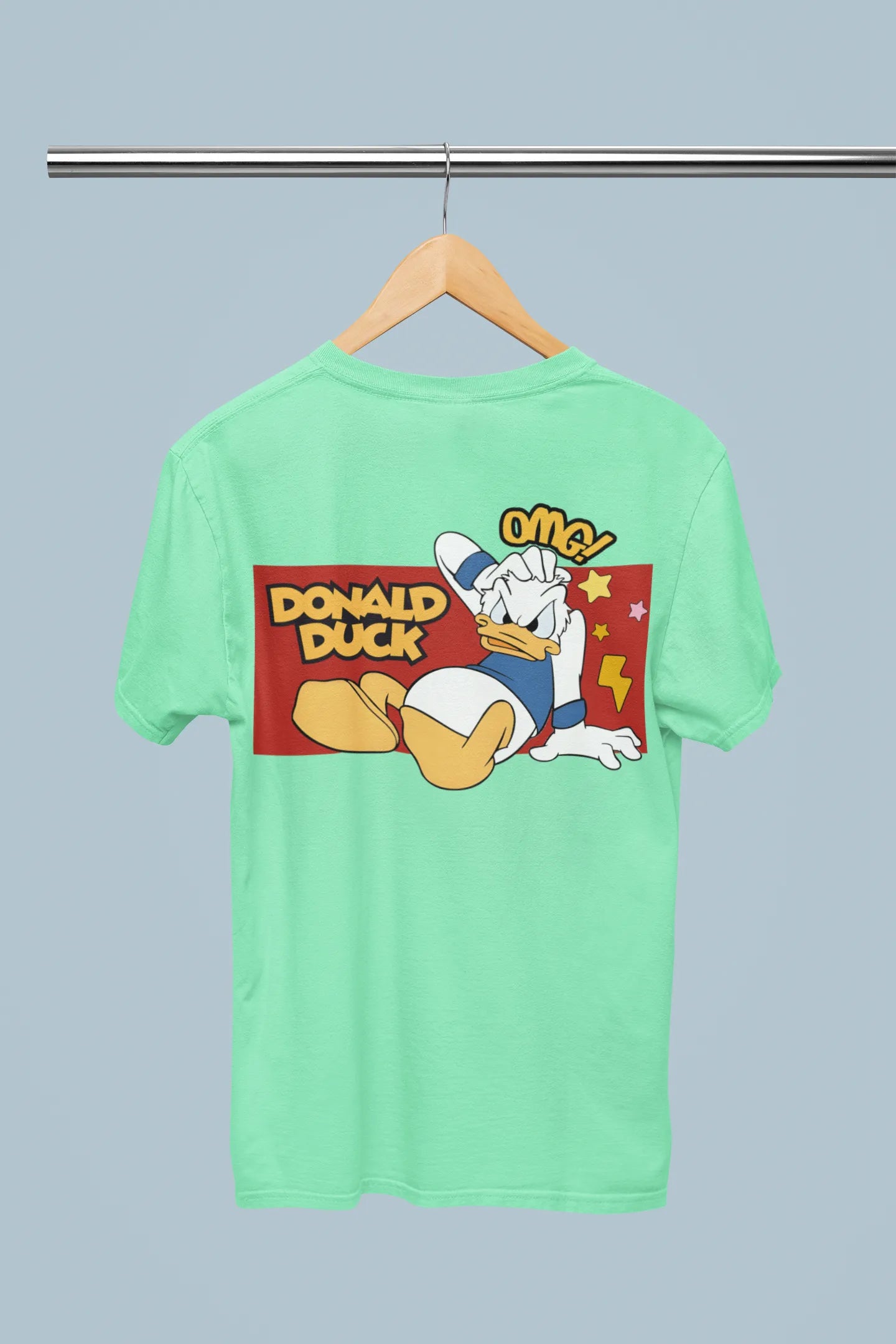 Back view of mint green oversized Disney collection t-shirt featuring a classic Donald Duck design .