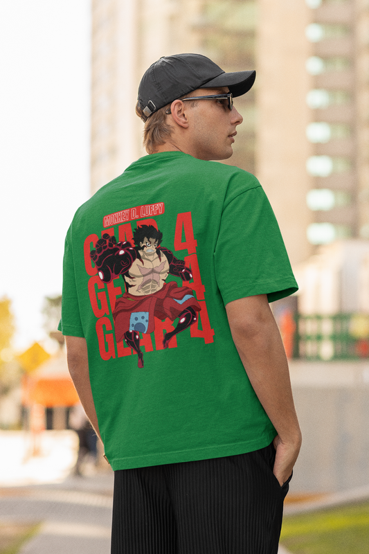 Back view of a male model wearing a forest green oversized t-shirt featuring Luffy in his Gear 4 Bounceman form from the One Piece anime.