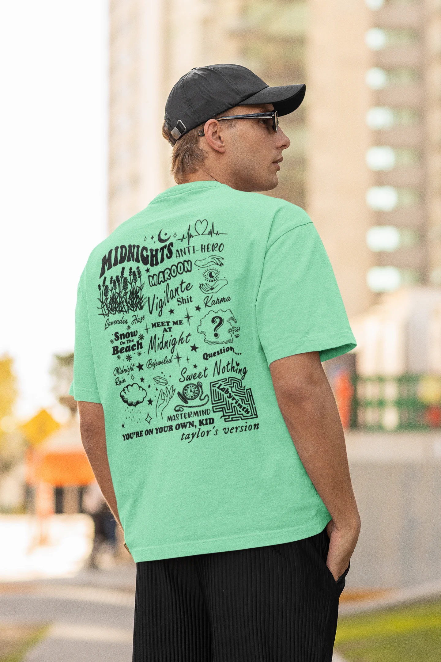 Back view of man wearing mint green Oversize T-shirt featuring Taylor Swift Midnight design