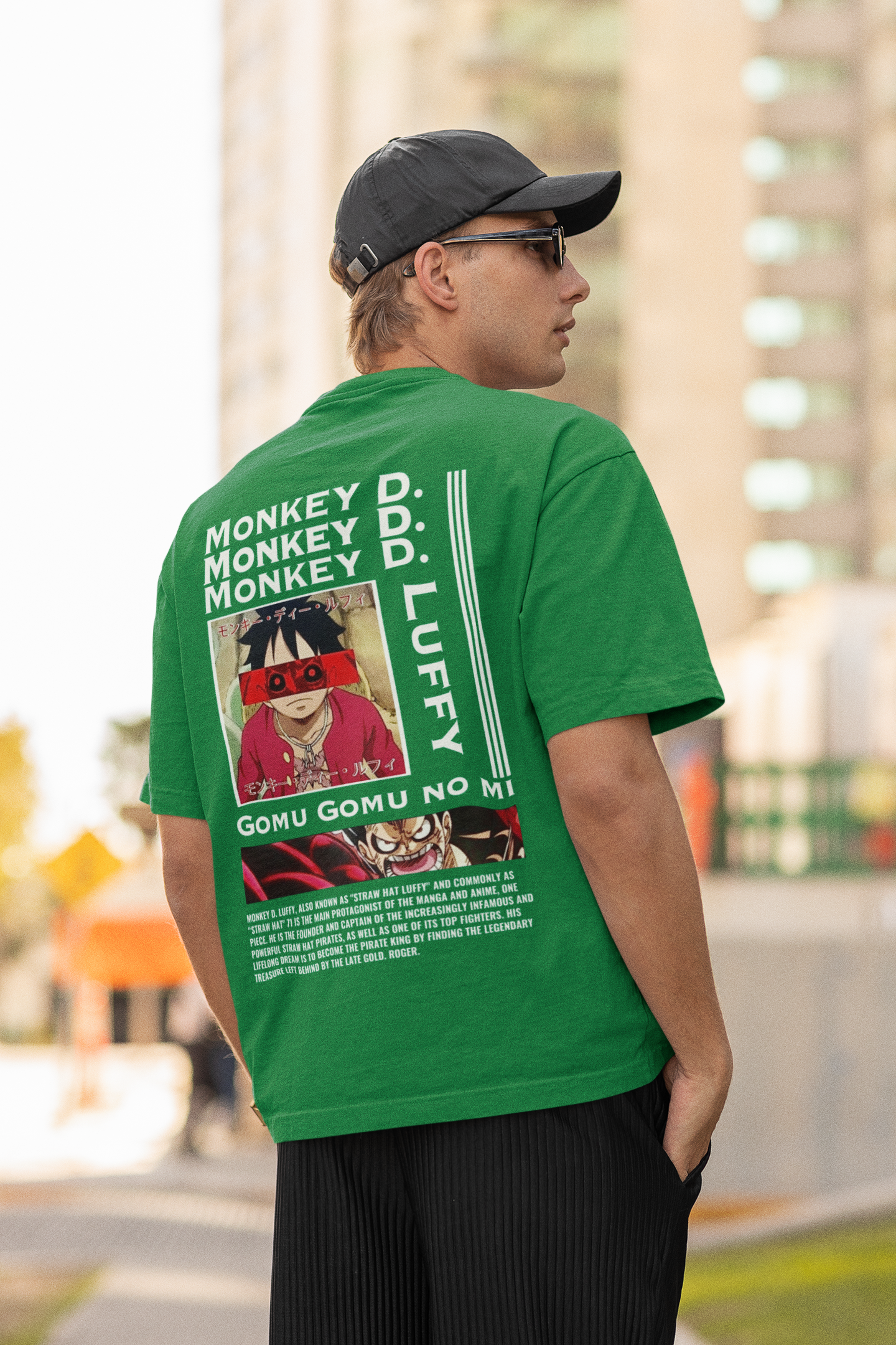 Back view of a male model wearing a forest green oversized t-shirt featuring Monkey D. Luffy from the One Piece anime.