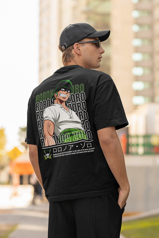 Back view of a male model wearing a black oversized t-shirt featuring Roronoa Zoro from the One Piece anime.