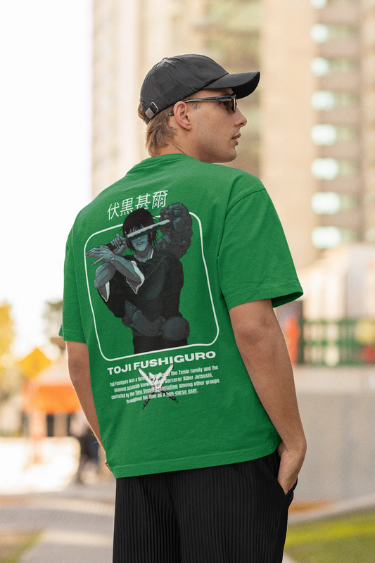 Back view of a male model wearing a forest green oversized t-shirt featuring Toji Fushiguro from the Jujutsu Kaisen anime.