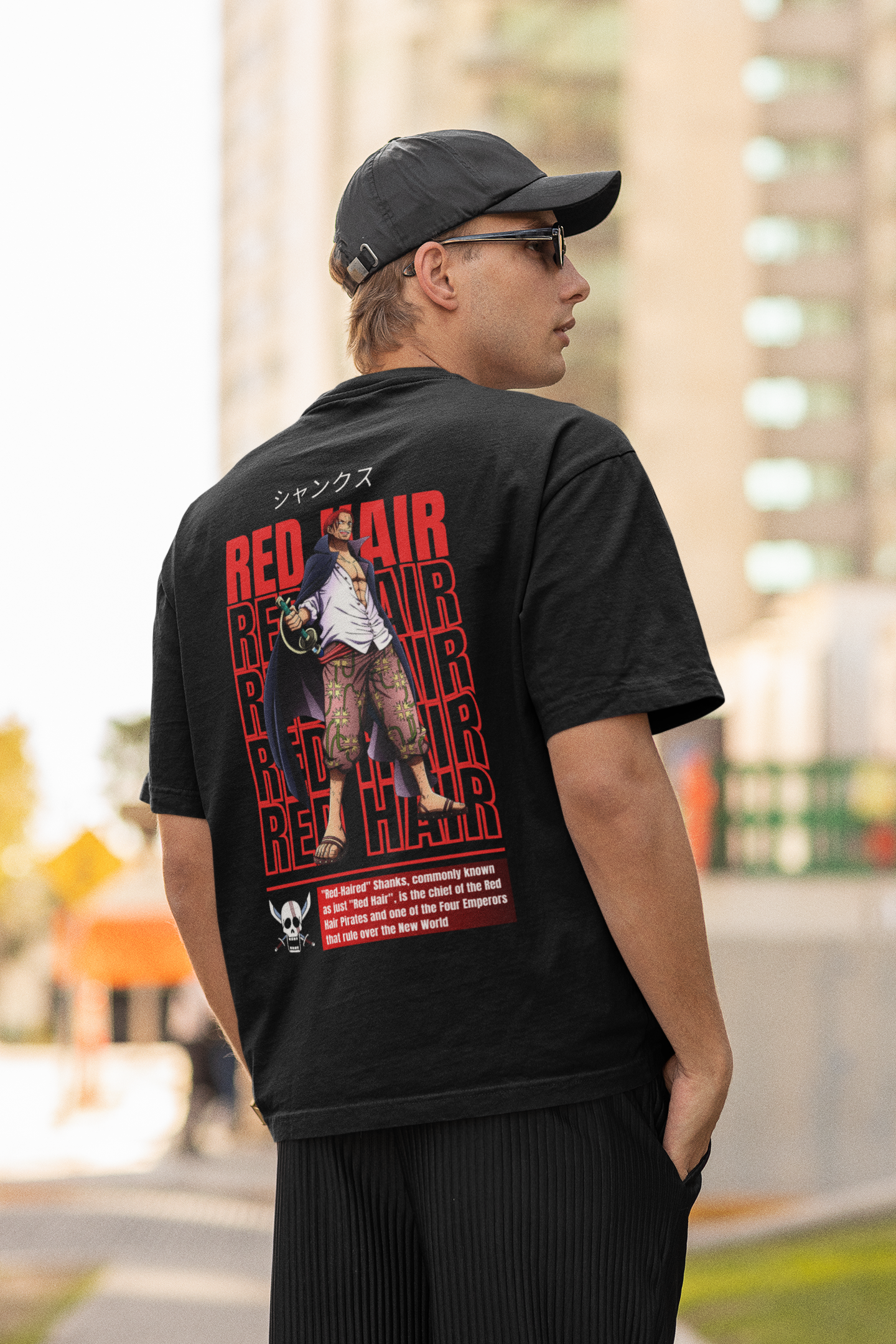 Back view of a male model wearing a black oversized t-shirt featuring Red-Haired Shanks from the One Piece anime.