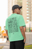 Back view of male model wearing a mint green oversized F.R.I.E.N.D.S. t-shirt featuring a design inspired by Joey Tribbiani's funny quotes and signature charm.