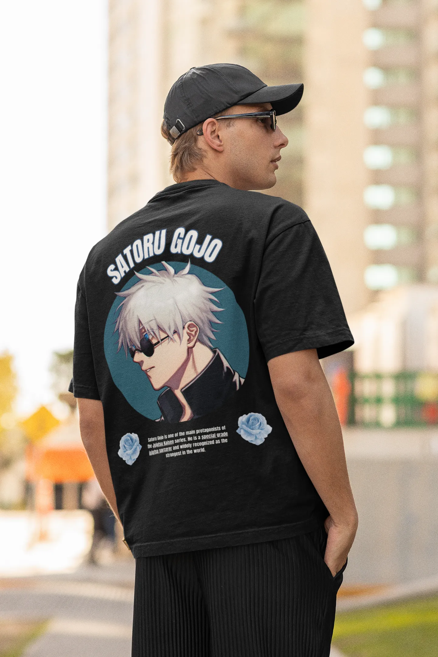Back view of a male model wearing a black oversized t-shirt featuring Gojo Satoru from Jujutsu Kaisen with the text "Satoru Gojo."