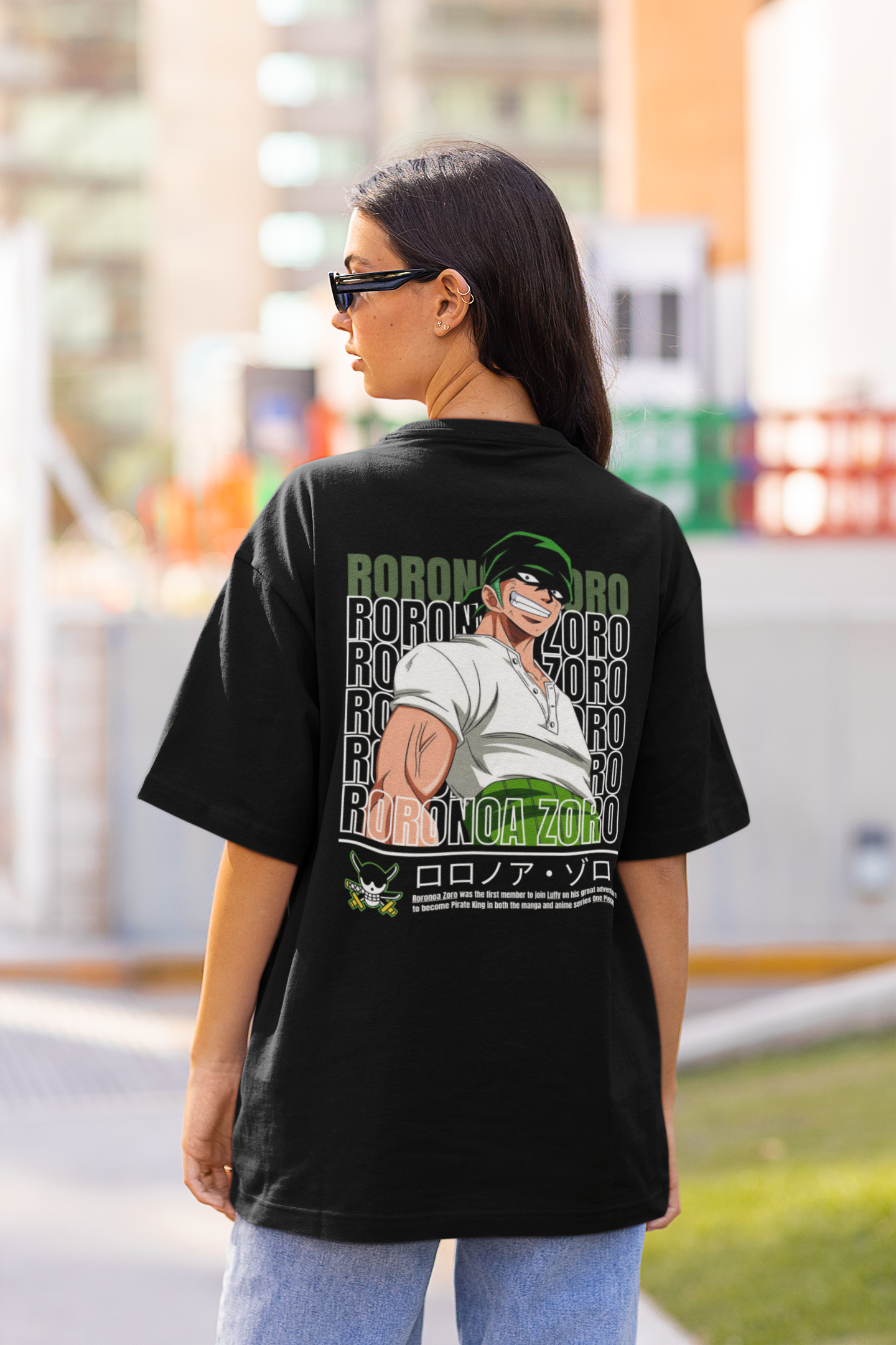 Back view of a female model wearing a black oversized t-shirt featuring Roronoa Zoro from the One Piece anime.