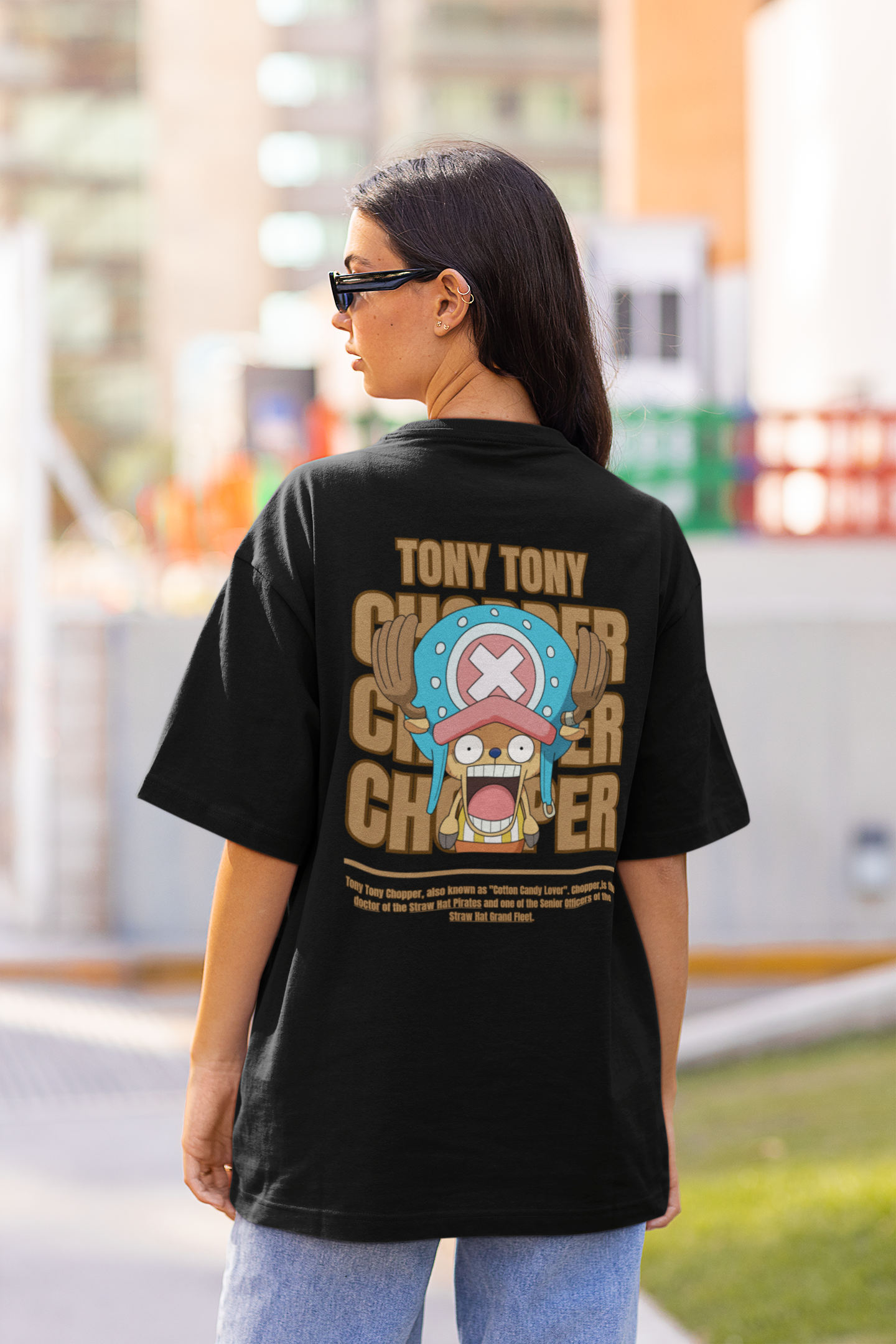 Back view a female model wearing a black oversized t-shirt featuring Tony Chopper from the One Piece anime.