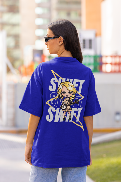 Back view of female model flaunting Taylor Swift-themed blue oversized tee, epitomizing rockstar chic with nods to Taylor's Version and Eras Tour.