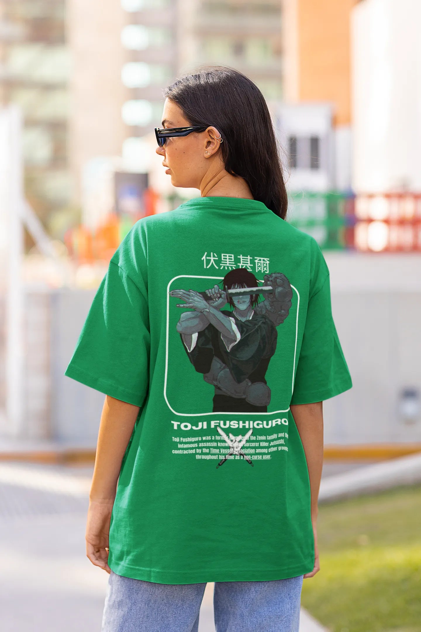 Back view of a female model wearing a forest green oversized t-shirt featuring Toji Fushiguro from the Jujutsu Kaisen anime.