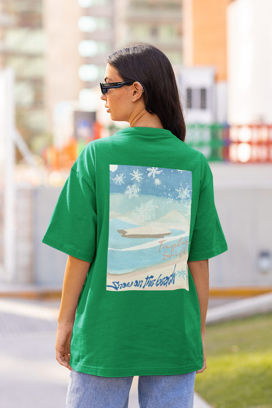 Back view of female model rocking green oversized tees with Taylor Swift 'Snow on the Beach' design, perfect for capturing the essence of 'Snow on the Beach' and celebrating Taylor's eras, including 'Midnights' and 'Taylor's Version'.