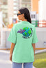 Back view of a female model wearing a mint green oversized t-shirt featuring a fun 