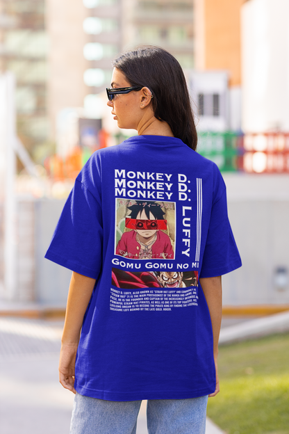 Back view of a female model wearing a royal blue oversized t-shirt featuring Monkey D. Luffy from the One Piece anime.