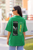 Back view of female model wearing a forest green oversized t-shirt featuring a captivating 