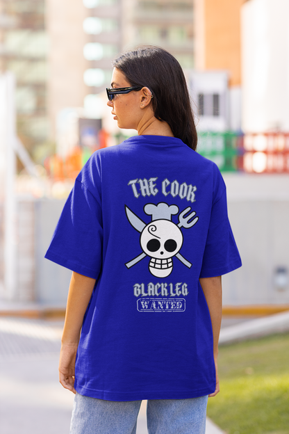 Back view of a female model wearing a royal blue oversized t-shirt featuring Sanji's skull and crossbones logo and the text "The Cook and Black Leg."