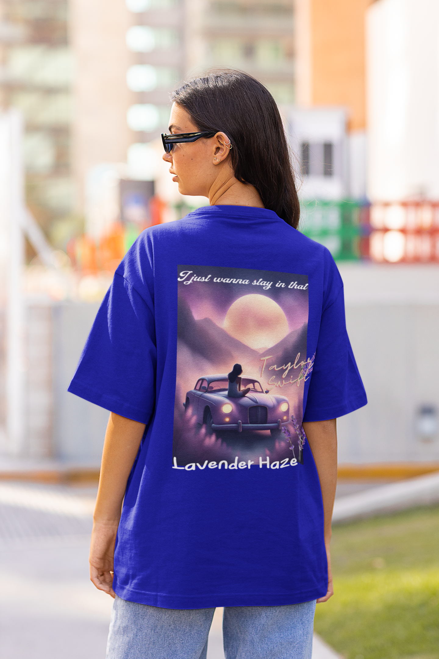 Back view of a woman wearing Blue Oversize T-shirt featuring Lavender Haze design, Taylor's Version from Taylor Swift album Midnights