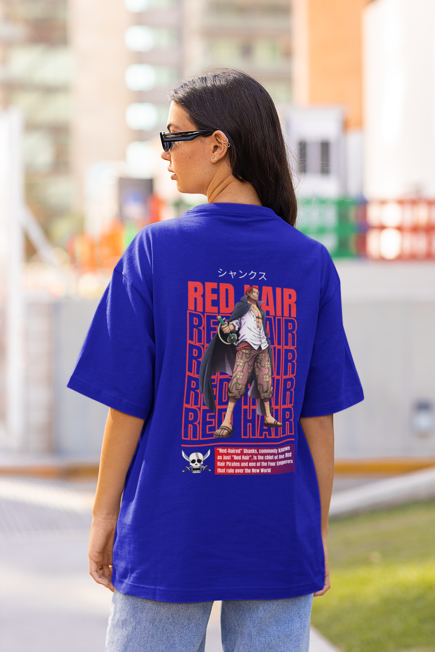 Back view of a female model wearing a royal blue oversized t-shirt featuring Red-Haired Shanks from the One Piece anime.