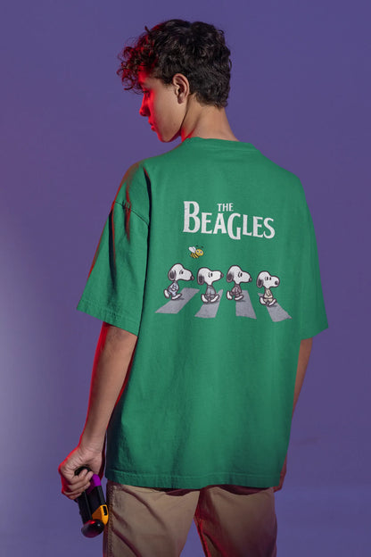 Back view of male Model showcasing forest green oversized tee with a The Beagles animated series themed design, featuring the cool canine quartet from ourt disney collection of oversized tees.