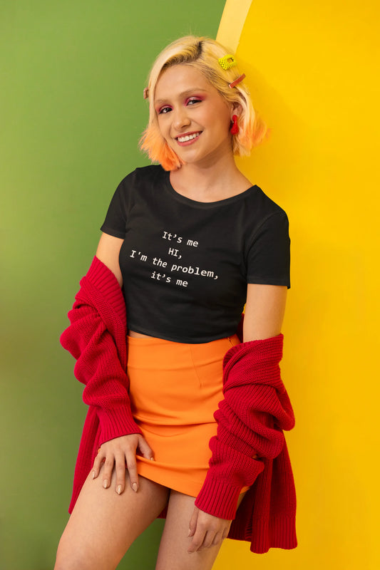 Side view of a female model wearing a  Black crop top with "Hi, it's me" design, perfect for Swifties and Eras Tour fans.