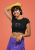 Left side view of female model wearing a black crop top with 