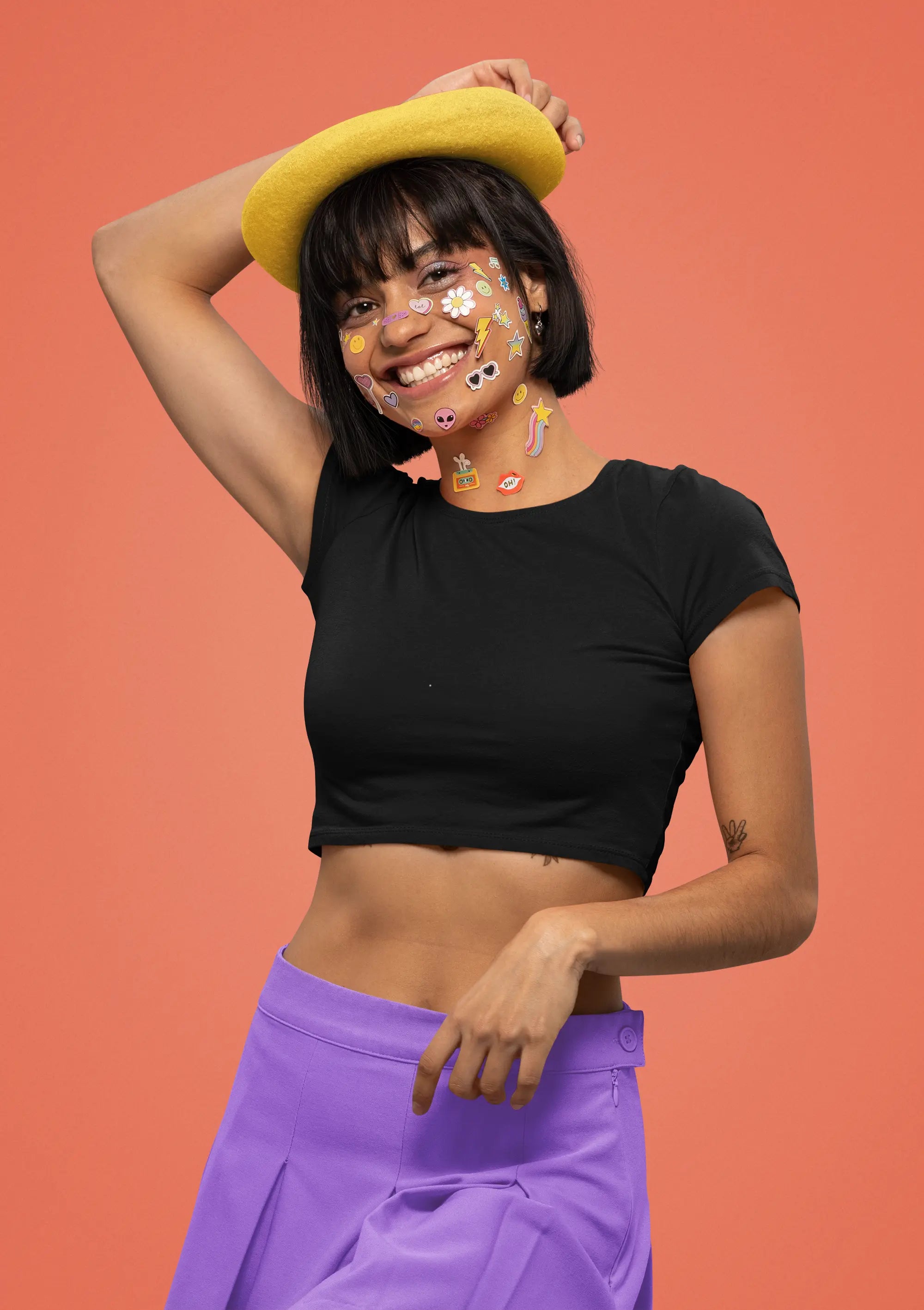 First front view of model wearing a stylish black crop top, exuding confidence and attitude.