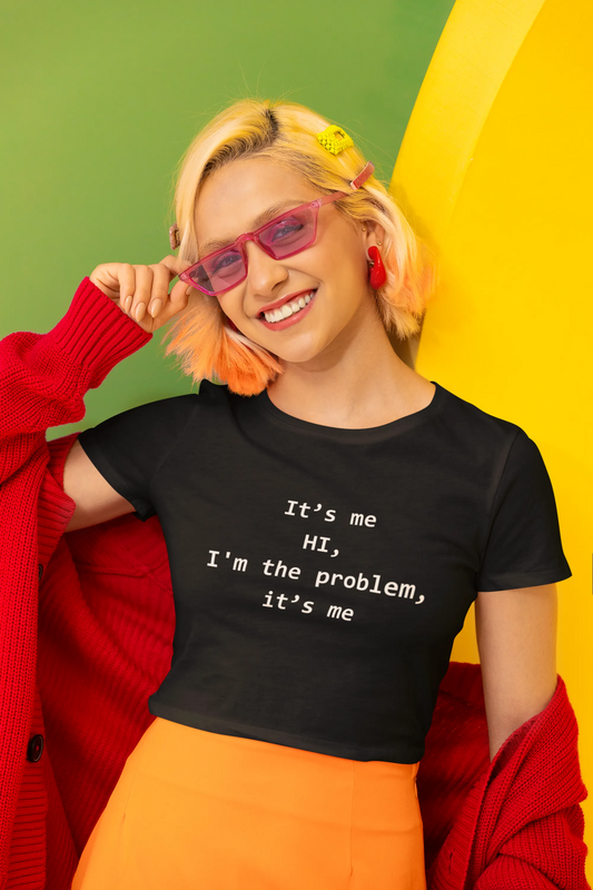 First front view of a female model wearing a  Black crop top with "Hi, it's me" design, perfect for Swifties and Eras Tour fans.