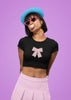 First front view of a female model wearing a stylish black crop top with a bow design, embodying the Pookie trend.