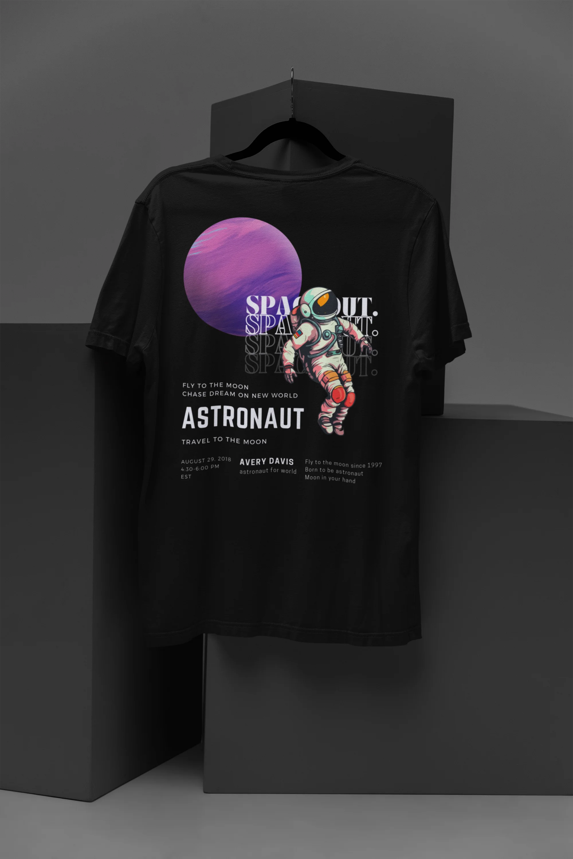 Back view of a black oversized t-shirt featuring a design inspired by the cosmos and galaxies "Fly Me to the Moon" and subtle hints of space exploration.