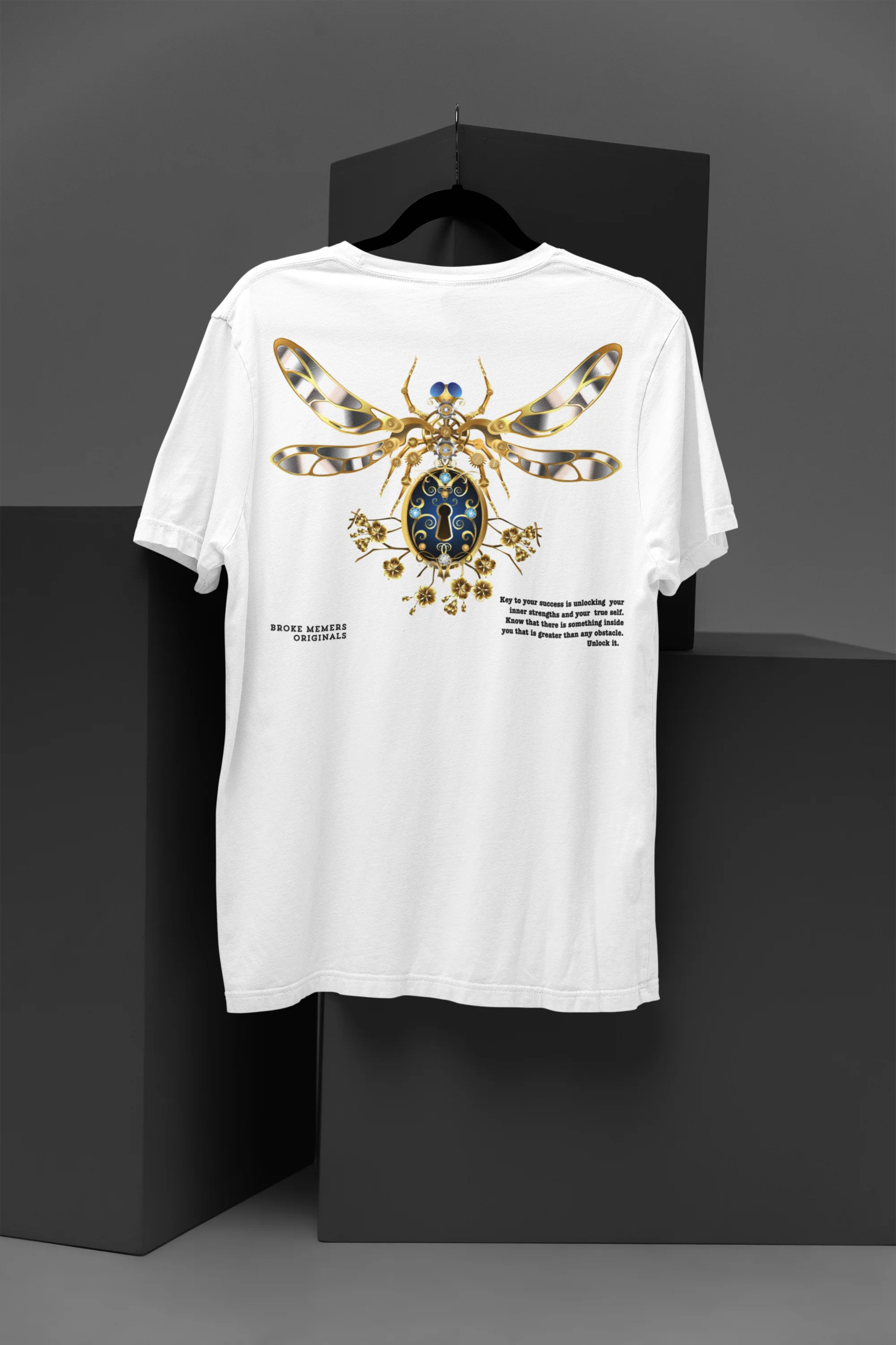 A off-white oversized t-shirt featuring a thought-provoking design of a golden lock shaped like an insect. Ideal for those who love symbolic clothing and unique conversation starters.