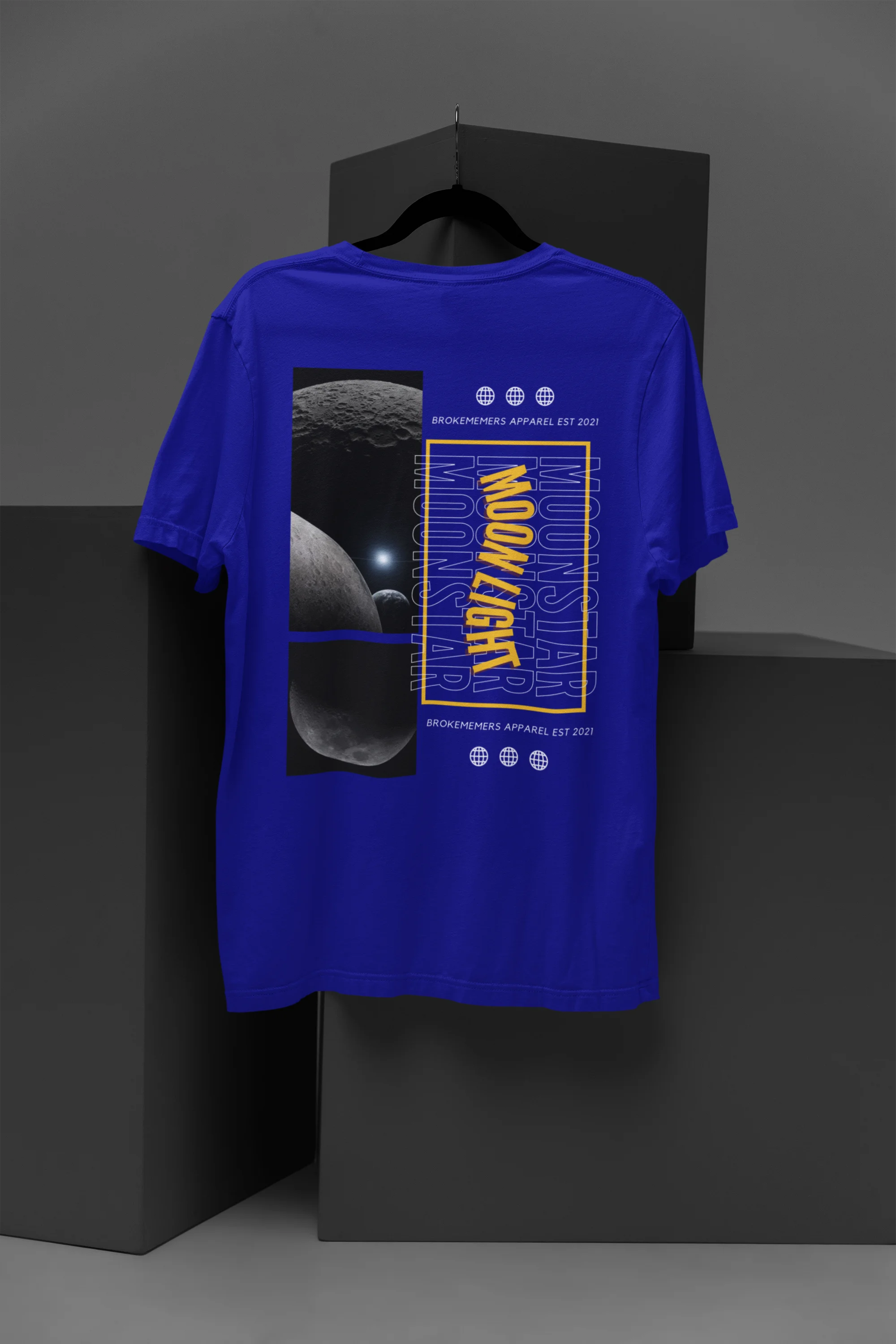 Back view of a royal blue oversized t-shirt featuring a captivating "moonlight" design with subtle elements of the Milky Way galaxy, planets, and the soft glow of the moon.