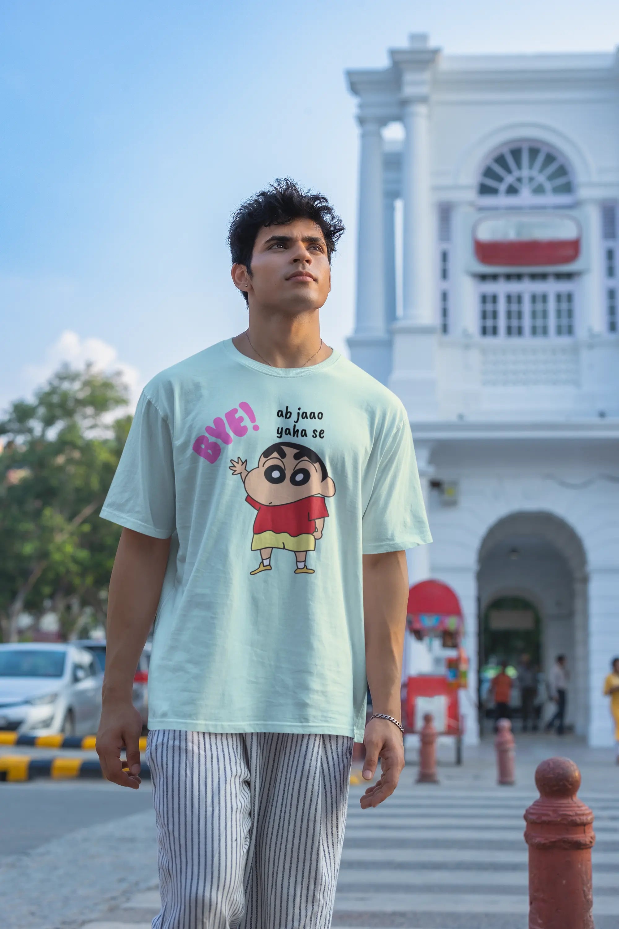 Second front view of an male model wearing an mintgreen  oversized tee featuring Shinchan saying "Ab Jhao" in Hindi. A perfect blend of humor and nostalgia for Shinchan fans.