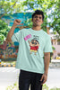 First front view of an male model wearing an mintgreen  oversized tee featuring Shinchan saying 