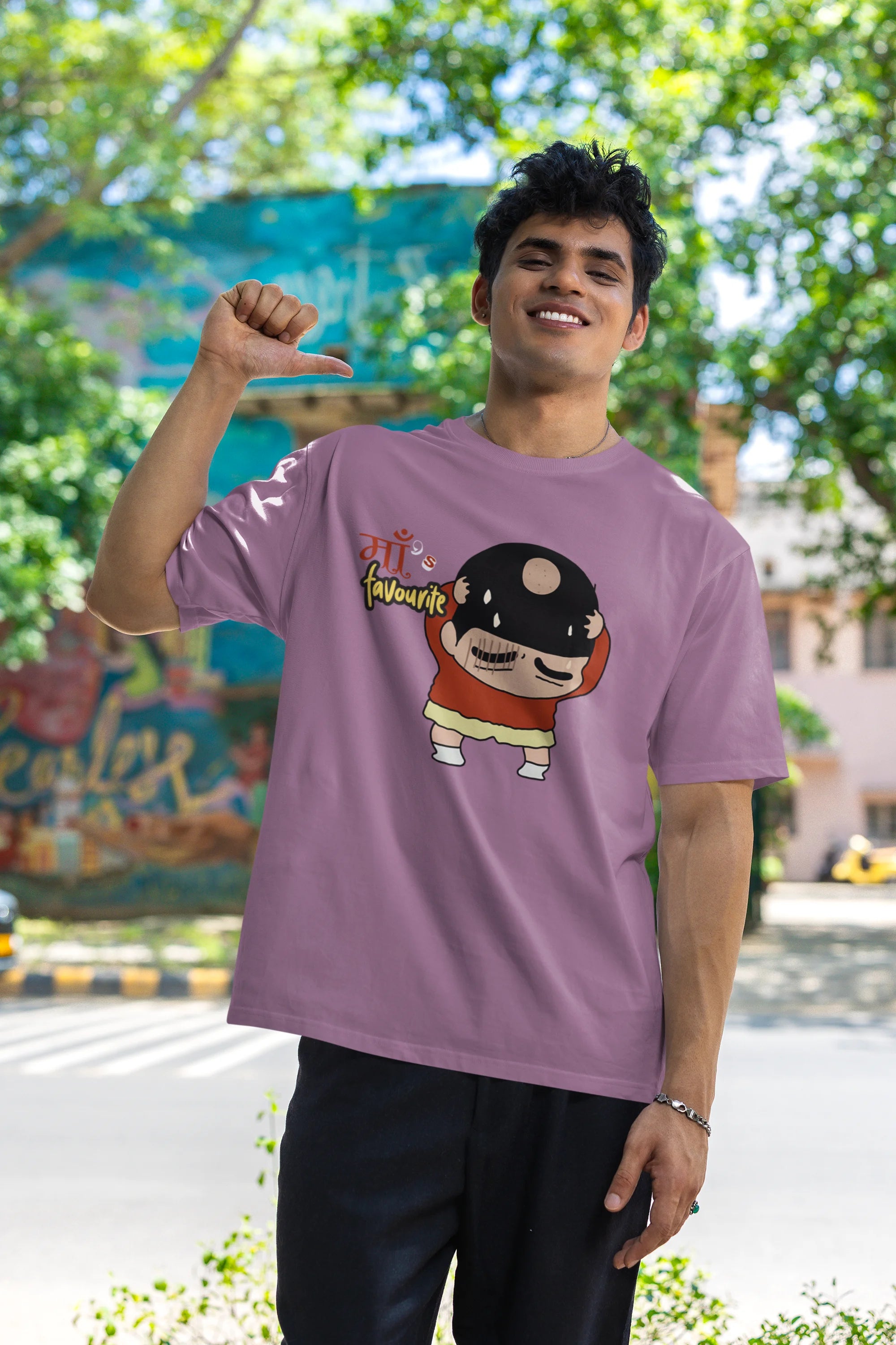 First front view of male model wearing a dirty purple oversized tee featuring Shinchan with a classic bump on his head. A perfect blend of humor and nostalgia for Shinchan fans.