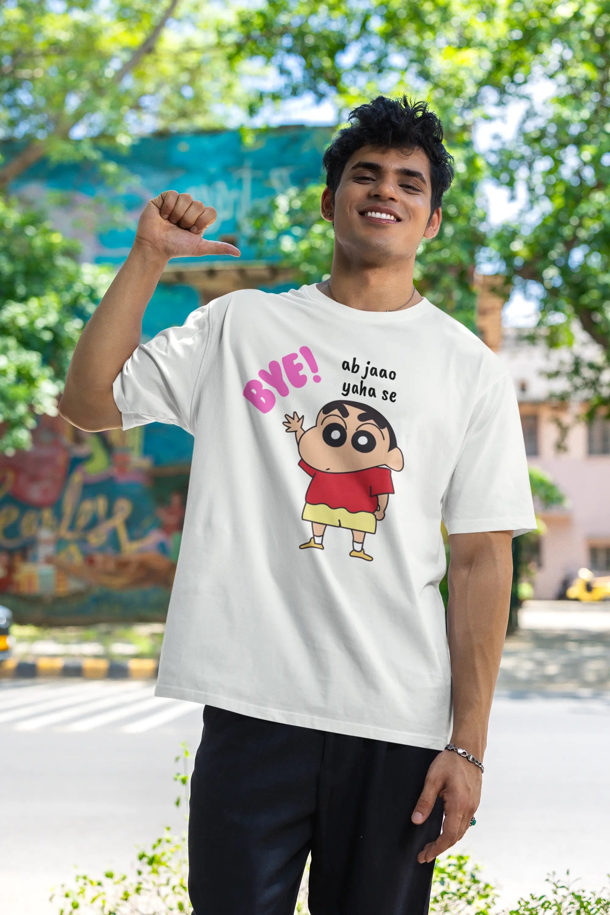 First front view of an male model wearing an off-white oversized tee featuring Shinchan saying "Ab Jhao" in Hindi. A perfect blend of humor and nostalgia for Shinchan fans.