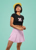 Second front view of a female model wearing a stylish black crop top with a bow design, embodying the Pookie trend.