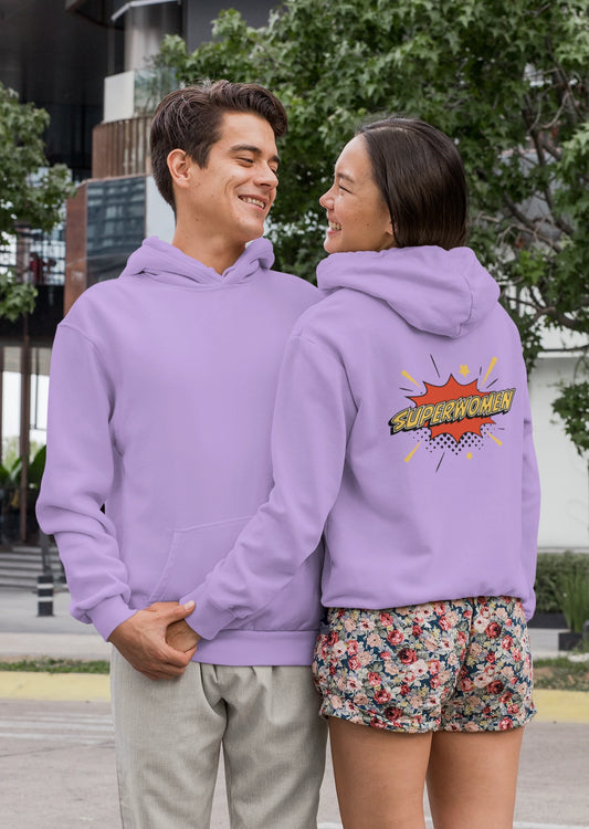 First front and back view of a couple wearing matching lavender hoodies, one with the word "Superhero" and the other with the word "Superwoman" in a flashy font.