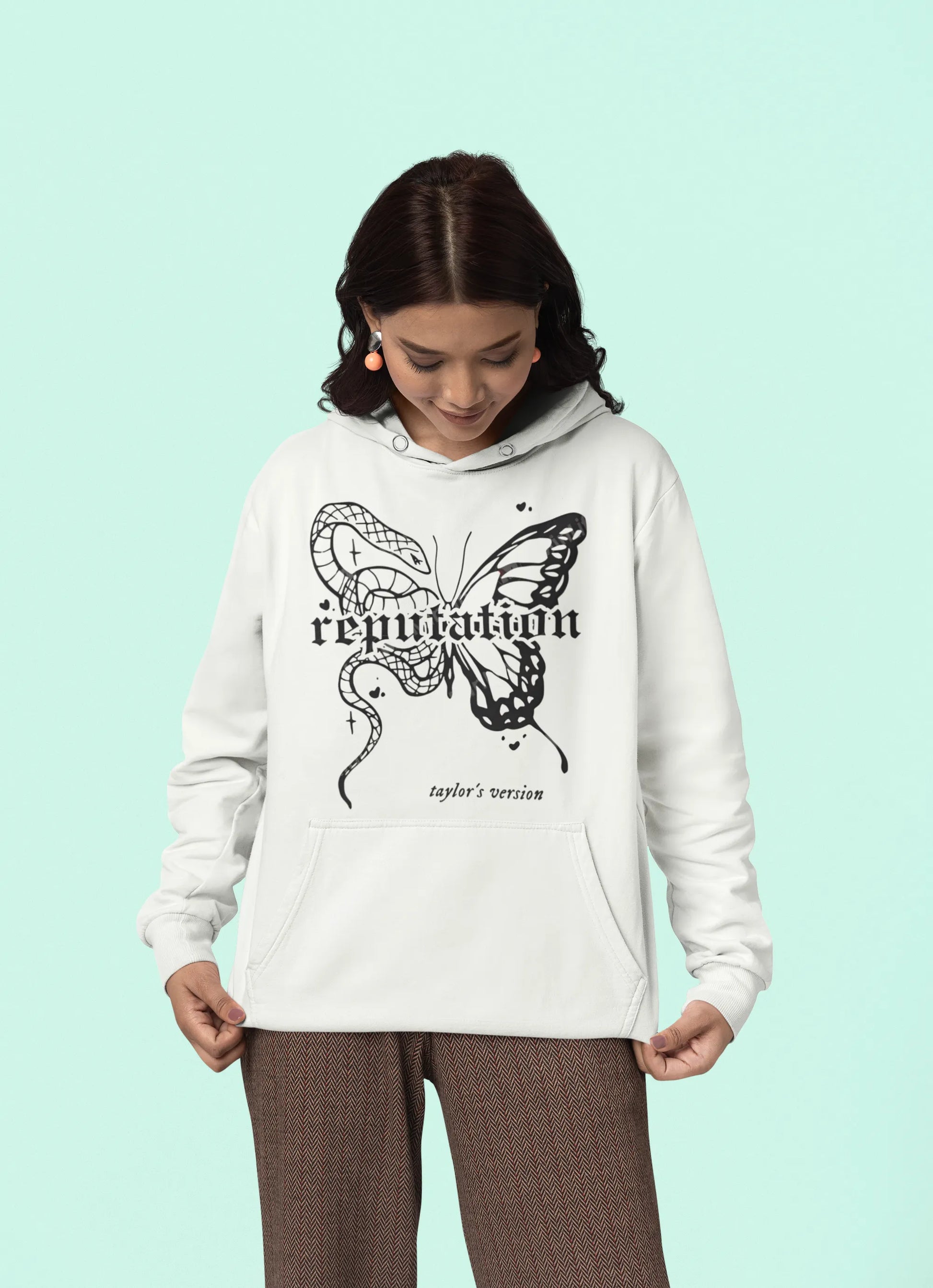 First front view of a female model wearing a off-white Reputation-inspired hoodie, perfect for Taylor Swift fans and Eras Tour enthusiasts.