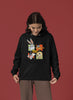 Fourth image of a female model wearing a black hoodie with a large Looney Tunes design. The illustration features portraits of several iconic Looney Tunes characters.