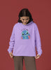 Fourth front view of a female model wearing a lavender hoodie with a large Stitch design. The illustration shows Stitch smiling and waving.