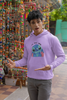 First front view of a male model wearing a lavender hoodie with a large Stitch design. The illustration shows Stitch smiling and waving.