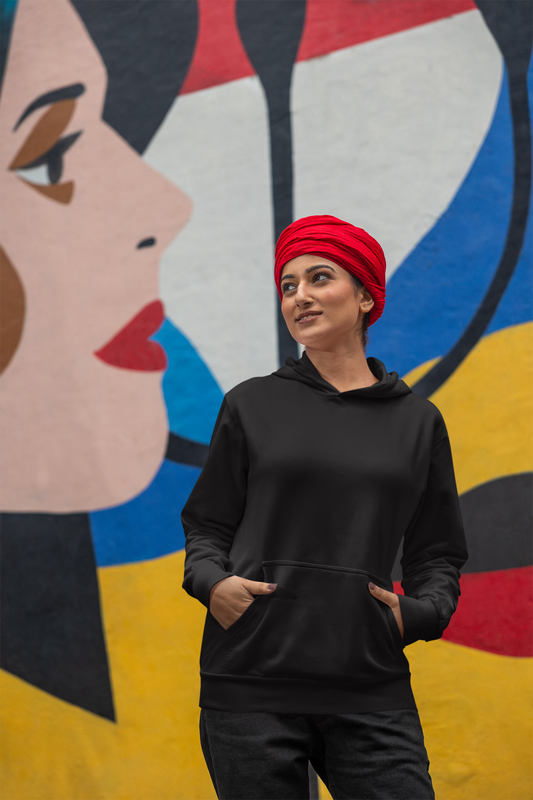 Front view of a female model wearing a black hoodie with the text "Diplo Jatt Kithe Aai" and a vibrant design.