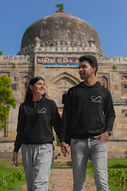 First front view of a couple wearing matching hoodies, each with an infinity loop design and Roman numerals underneath.