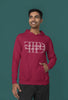 First front view of a male model wearing a maroon oversized, cozy hoodie featuring 